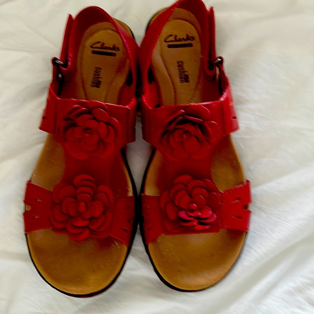 Red wedge Clark sandal. Floral and topstitch detailing.